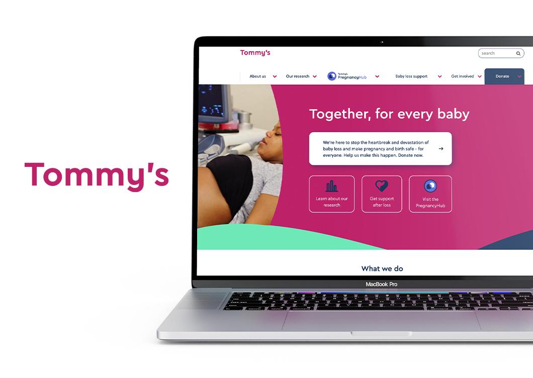 Tommy's logo and Tommy' website showing on laptop screen