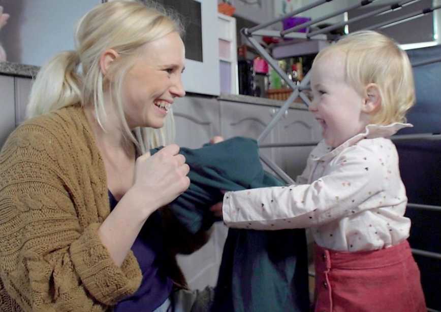 mum_and_child_doing_laundry.png