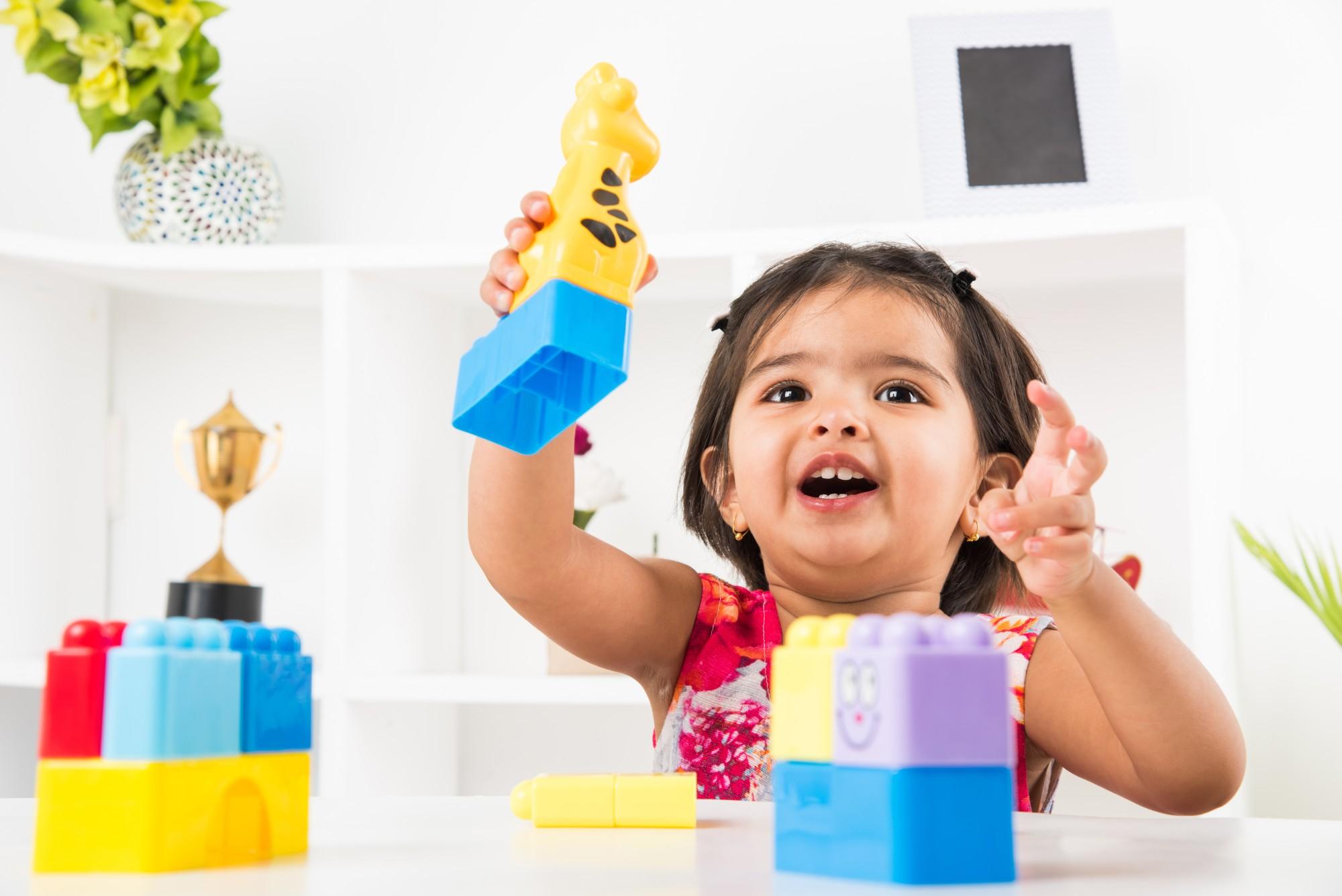 Child playing with building blocks